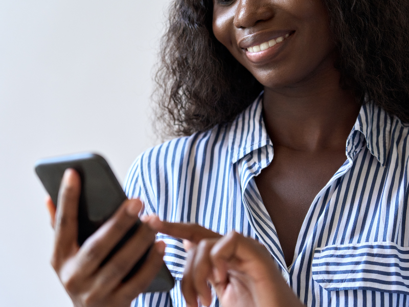 instant messaging apps - lady tapping smart phone for messaging