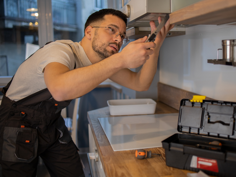 side business ideas - handyman repairing a shelf