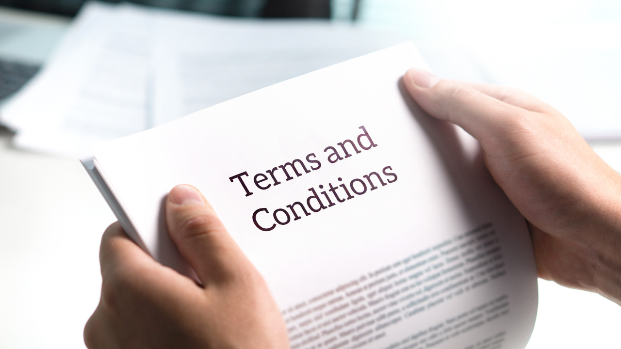 Short term loans - pic of person reviewing terms and conditions of their loans