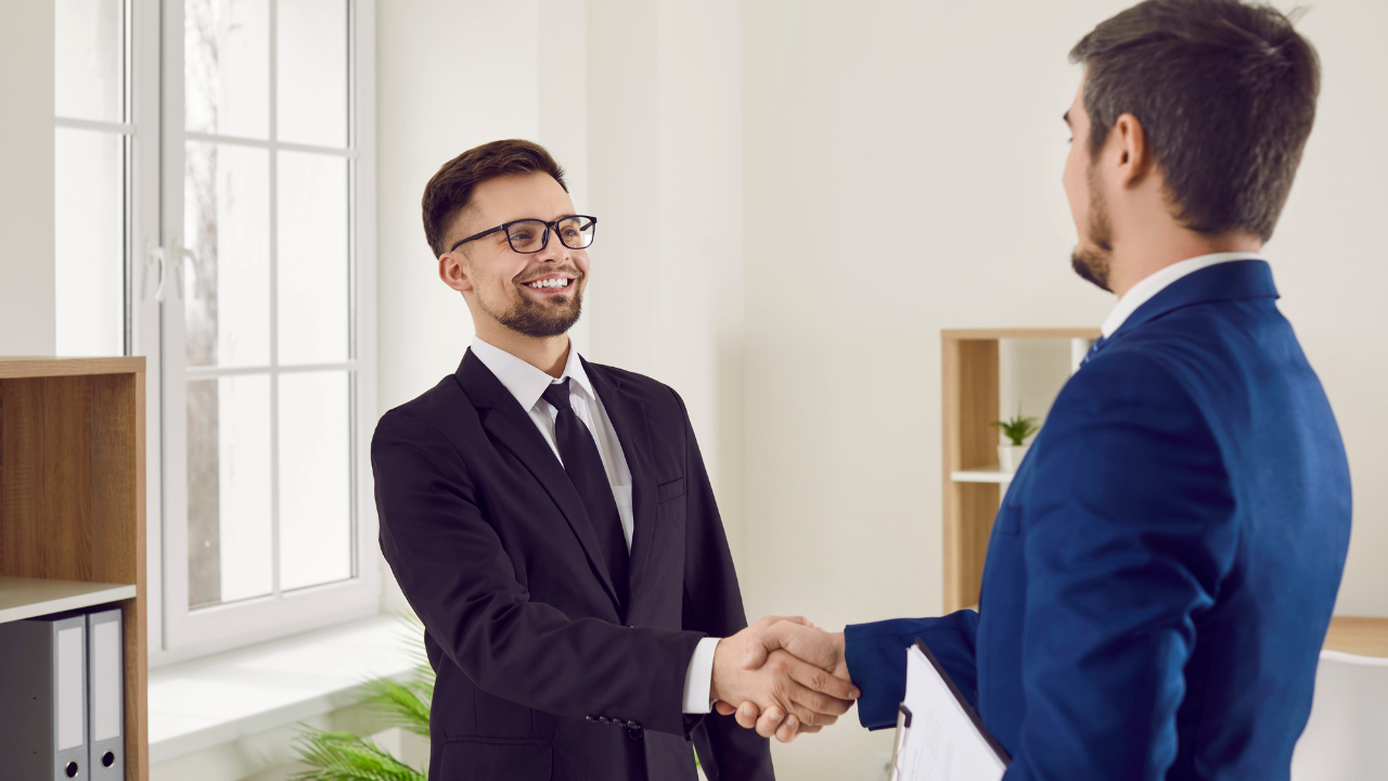 credible business loan broker  shaking hands with a client
